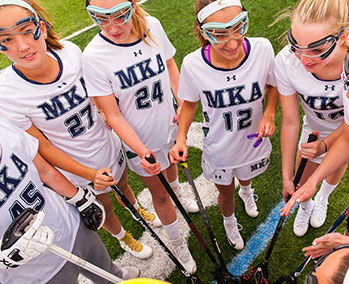 Photo of lacrosse players. Link to Gifts of Cash, Checks, and Credit Cards